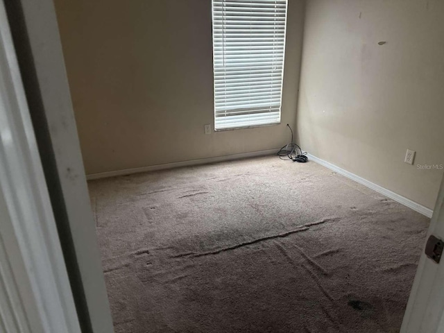 empty room with carpet flooring