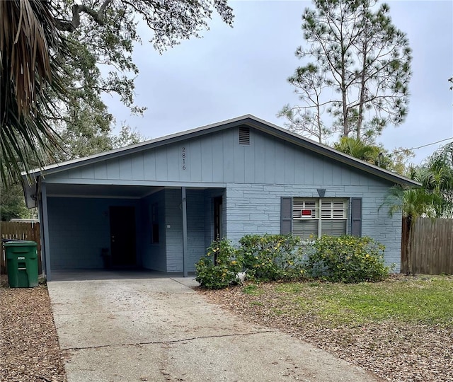 single story home with a carport