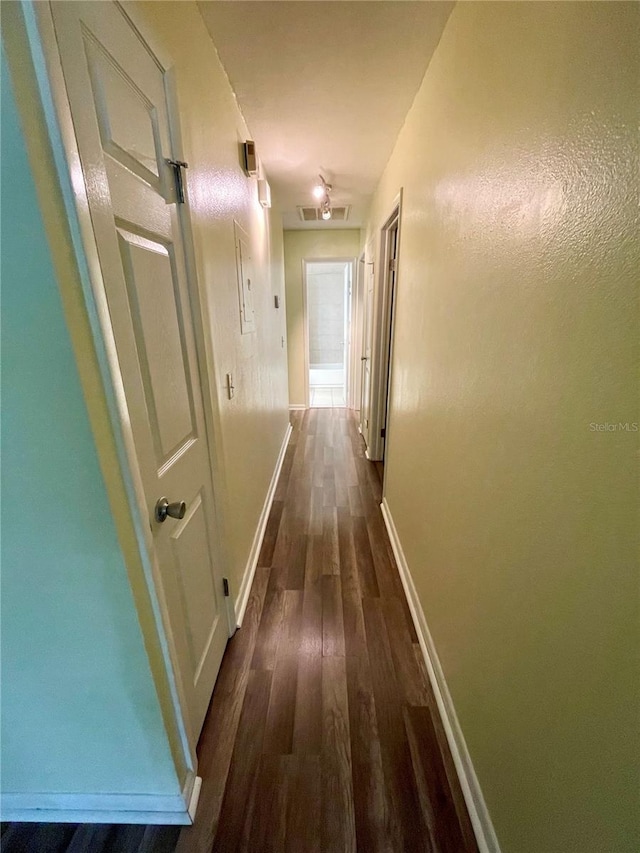 hall with dark wood-type flooring