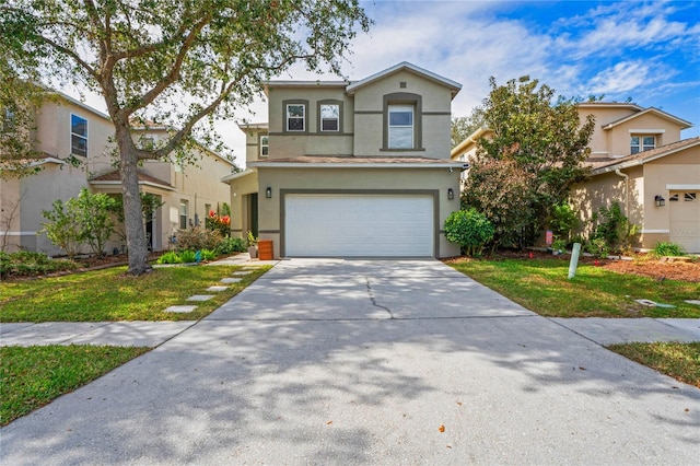 view of front of house with a garage and a front yard