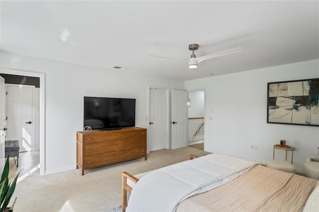 carpeted bedroom featuring ceiling fan