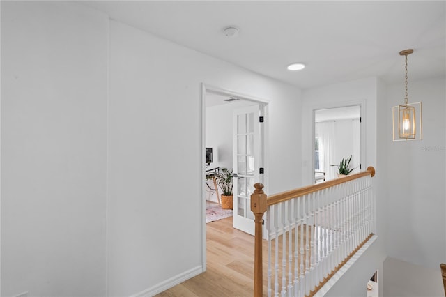 hall with light wood-type flooring