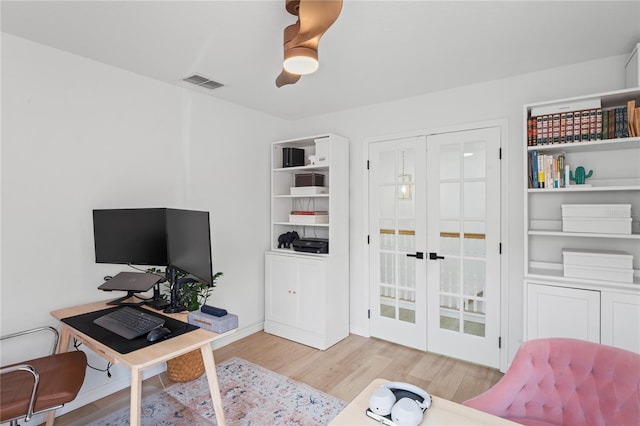 office area featuring light hardwood / wood-style flooring, french doors, and ceiling fan