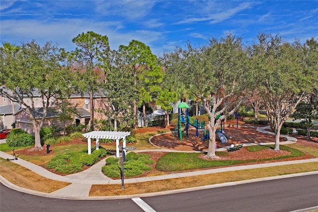 view of property's community with a pergola and a playground