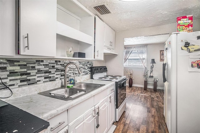 kitchen featuring sink, white appliances, white cabinetry, dark hardwood / wood-style floors, and decorative backsplash