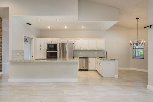 kitchen featuring kitchen peninsula, light stone countertops, and black appliances