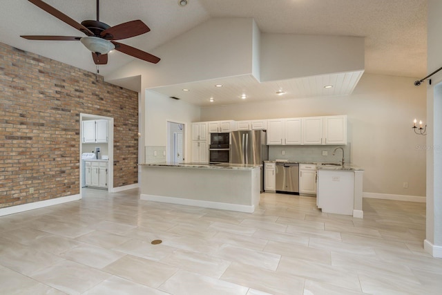 kitchen with sink, high vaulted ceiling, light stone counters, black appliances, and white cabinets