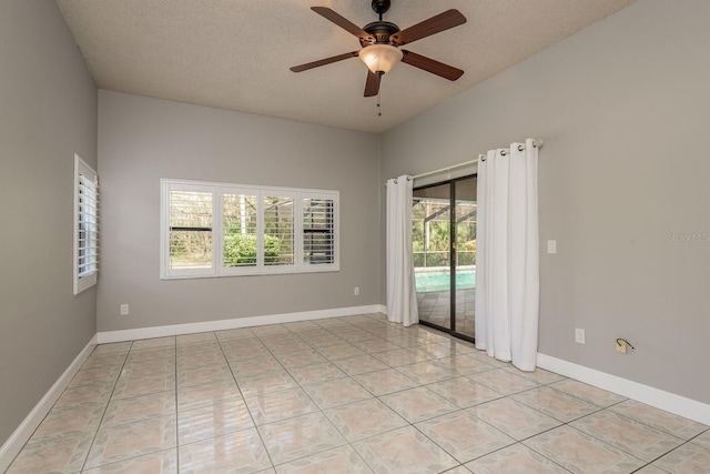 unfurnished room with light tile patterned flooring, ceiling fan, and a textured ceiling