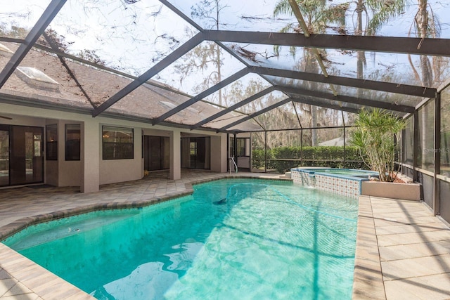 view of pool featuring an in ground hot tub, a lanai, and a patio