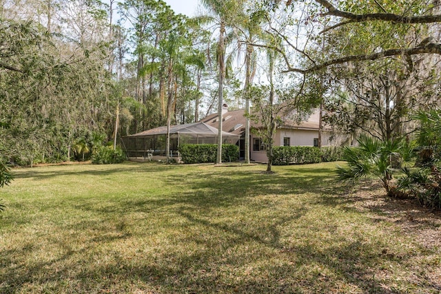 view of yard featuring a lanai