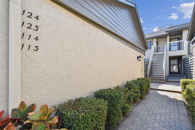 view of exterior entry with stucco siding