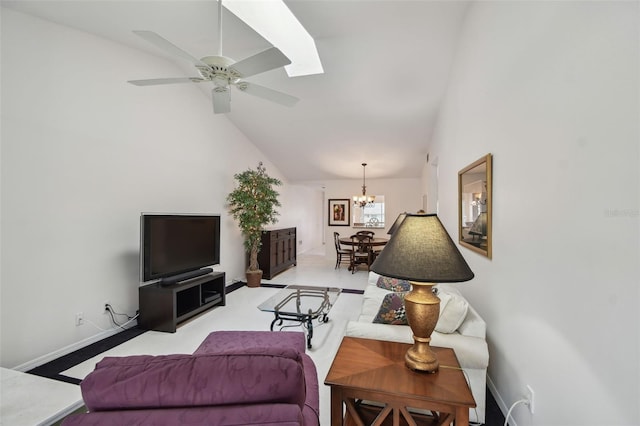 living room featuring ceiling fan with notable chandelier, baseboards, and high vaulted ceiling