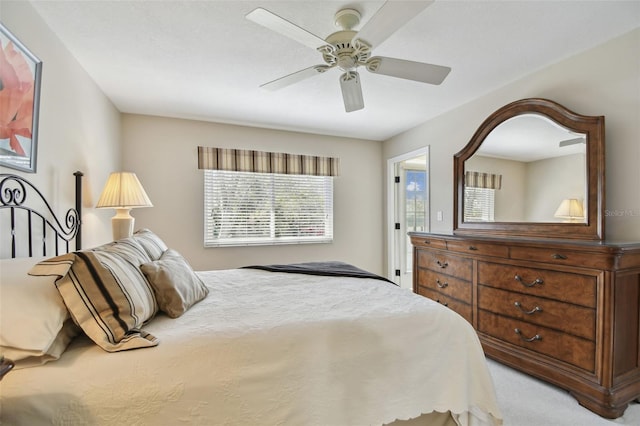 bedroom featuring ceiling fan and carpet floors