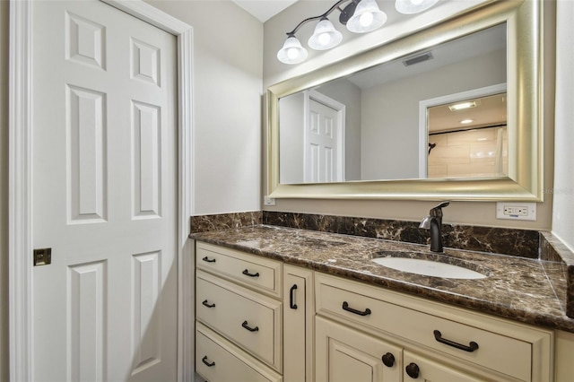 bathroom with visible vents and vanity