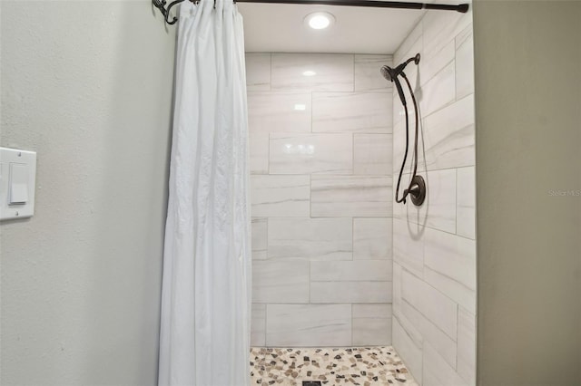 bathroom featuring a shower stall