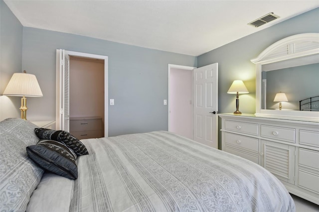 bedroom featuring visible vents