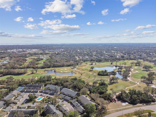 bird's eye view featuring golf course view and a water view