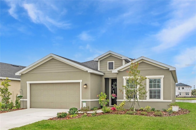 view of front of house featuring a garage and a front lawn