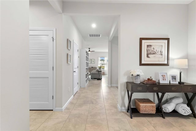 corridor with light tile patterned floors