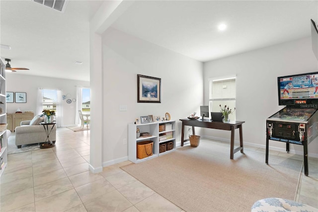 tiled home office with ceiling fan