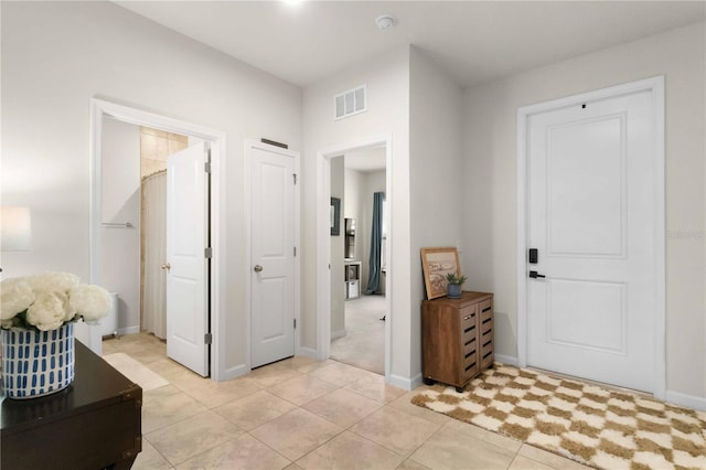 foyer entrance featuring light tile patterned floors