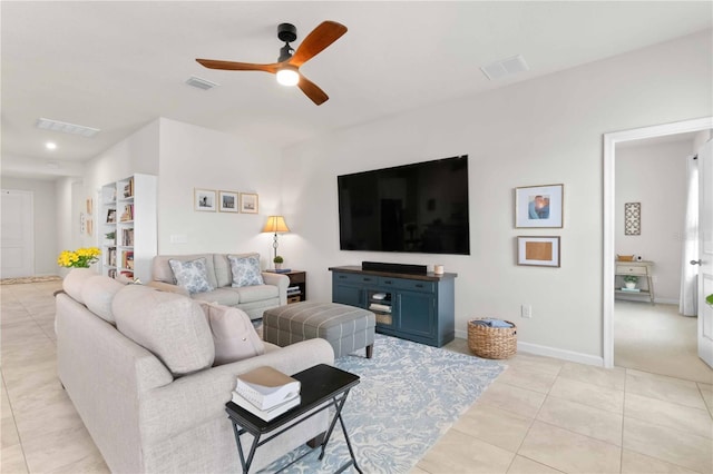 tiled living room featuring ceiling fan