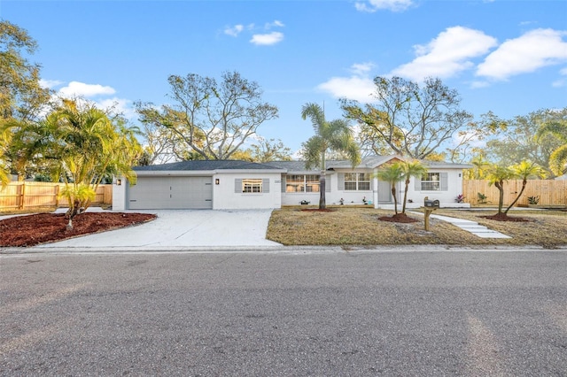 ranch-style house featuring a garage