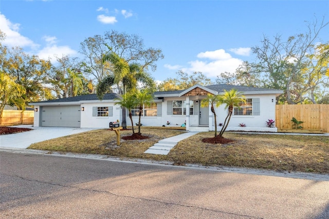 ranch-style home featuring a garage