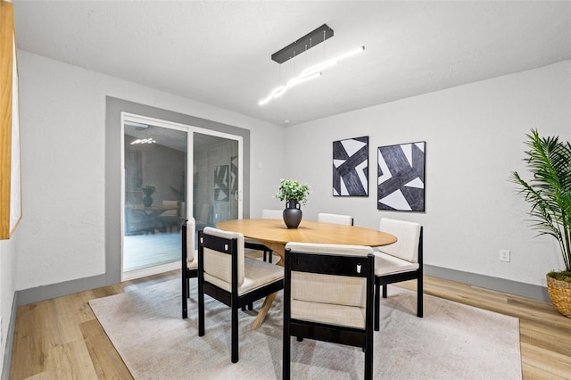 dining room with light wood-type flooring