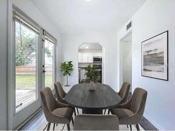 dining area with wood-type flooring