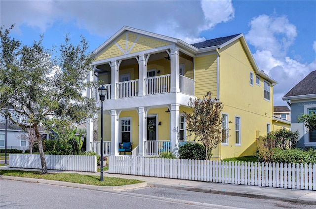 view of front of property with a balcony and covered porch