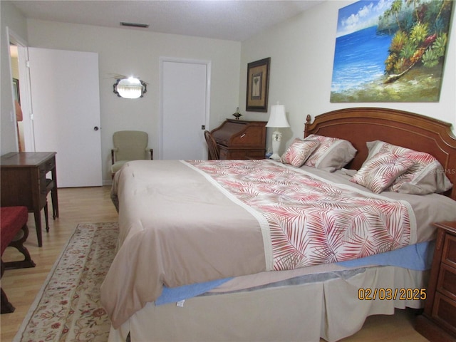 bedroom with light wood-type flooring