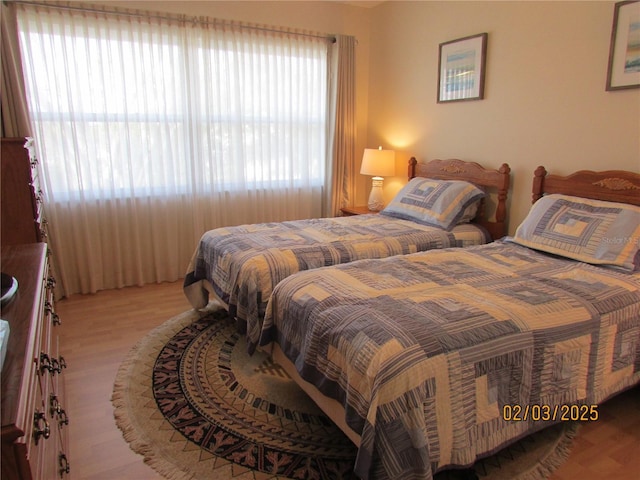 bedroom with light wood-type flooring