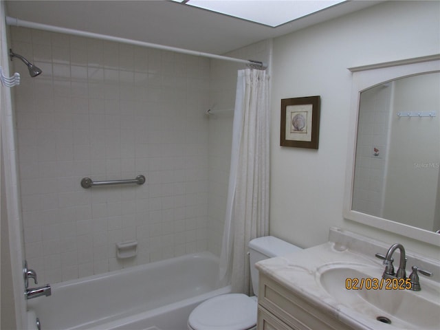 full bathroom featuring vanity, shower / bath combination with curtain, and toilet