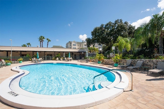 view of swimming pool featuring a patio