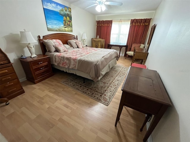 bedroom featuring light wood-style floors and ceiling fan