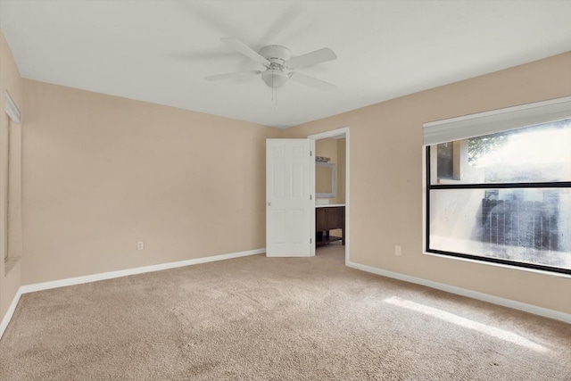 unfurnished bedroom featuring carpet and ceiling fan