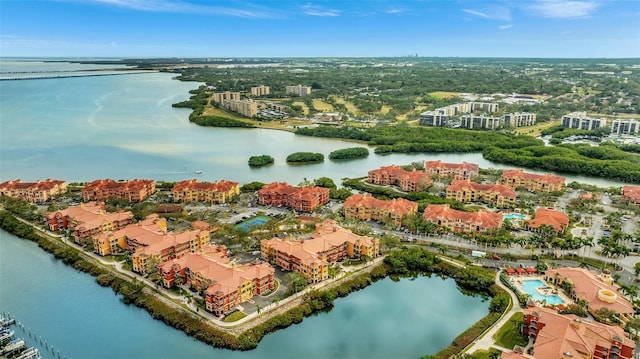 birds eye view of property with a water view