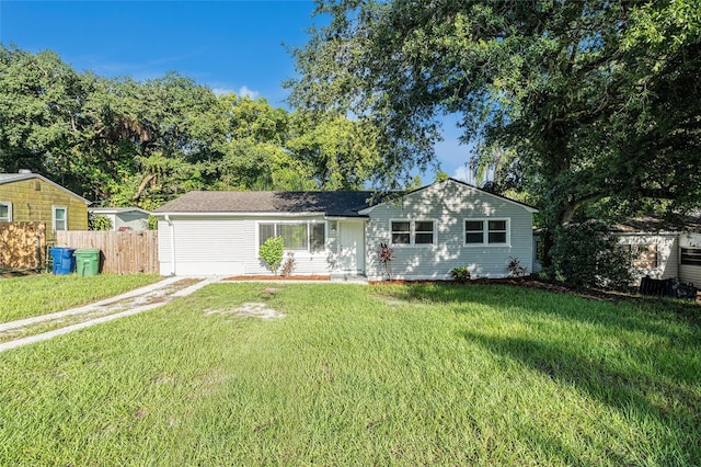 single story home with a front yard