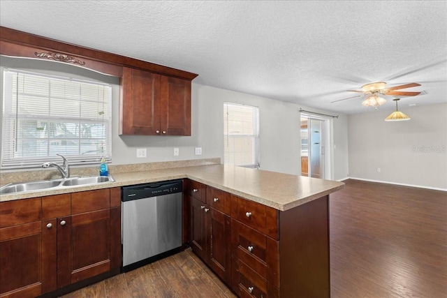 kitchen with dark wood-type flooring, sink, stainless steel dishwasher, kitchen peninsula, and a healthy amount of sunlight