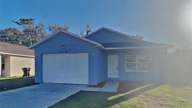 view of front facade featuring a garage and a front lawn