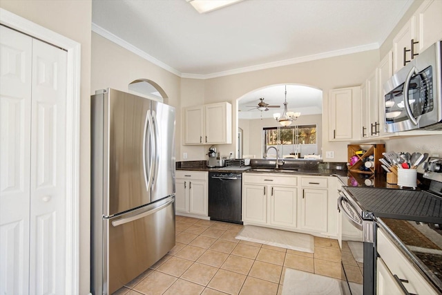 kitchen with sink, white cabinetry, light tile patterned floors, ornamental molding, and appliances with stainless steel finishes