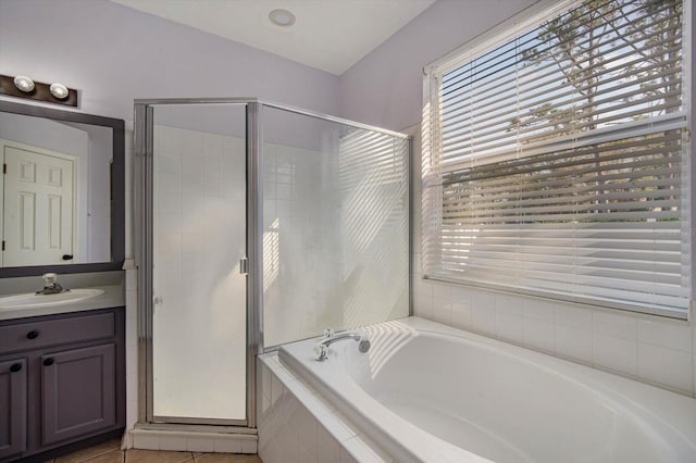 bathroom featuring vanity, a wealth of natural light, and separate shower and tub