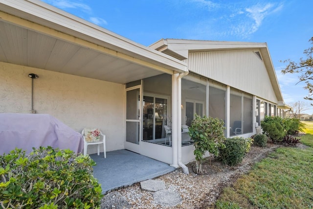 doorway to property with a patio