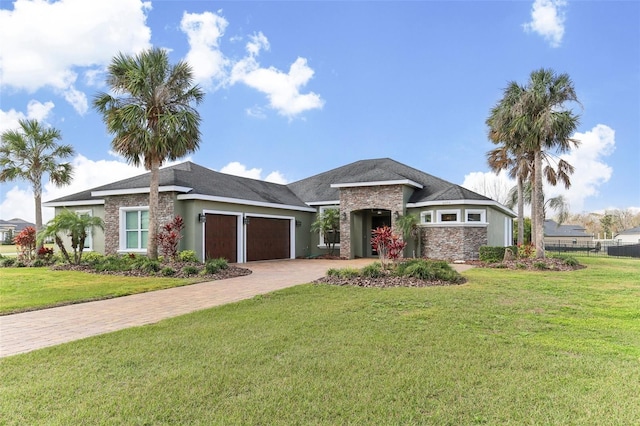 view of front facade with a front yard and a garage