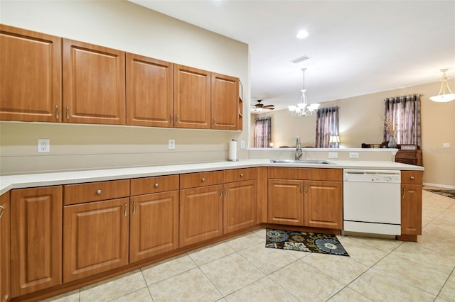 kitchen featuring decorative light fixtures, dishwasher, sink, and kitchen peninsula