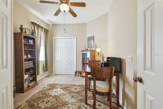 office featuring ceiling fan and light colored carpet