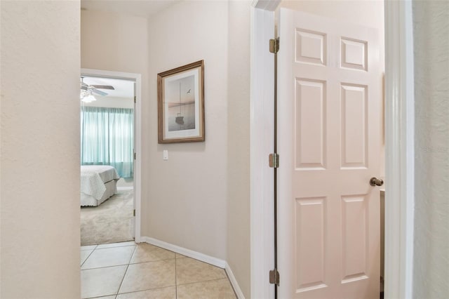 hallway with light tile patterned floors