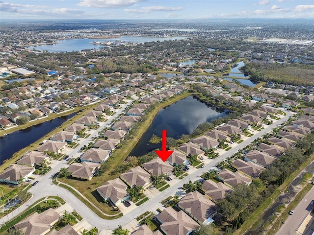 birds eye view of property featuring a water view