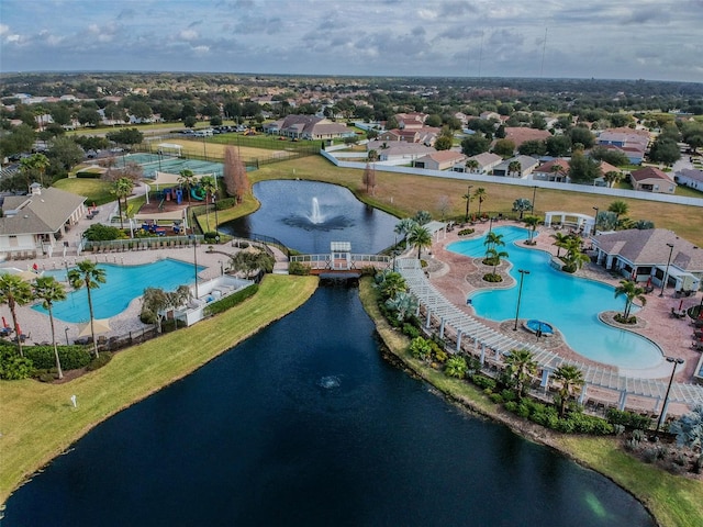 birds eye view of property with a water view